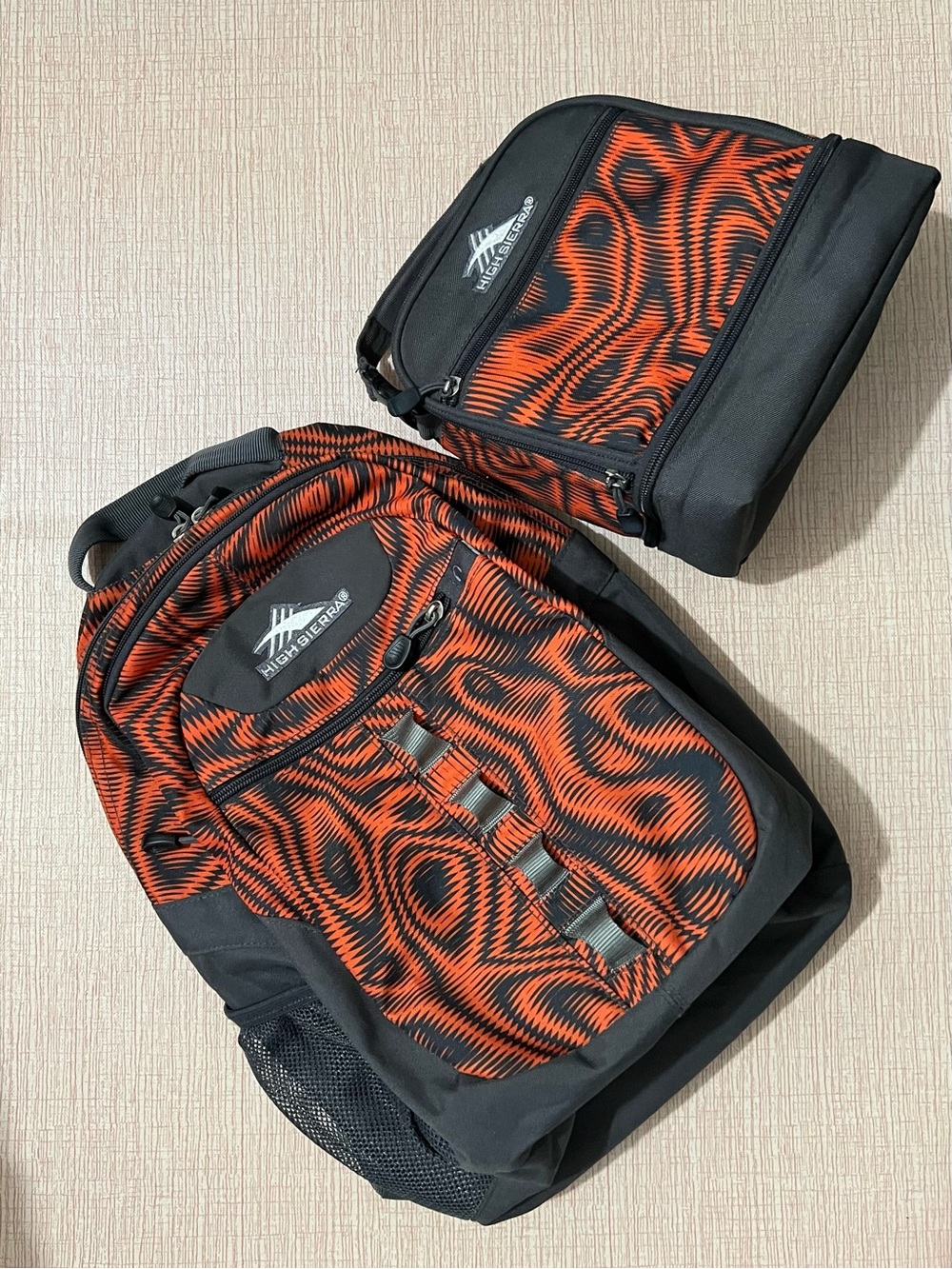 High Sierra Black and Orange Patterned Backpack with Matching Lunch Bag